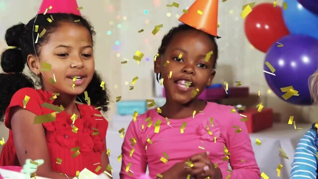 Animation of gold confetti falling over happy diverse girls celebrating at birthday party