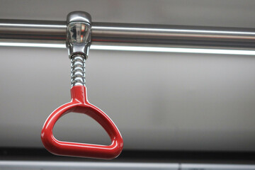 Central Station, Hong Kong- 16 Feb 2024: close up of red handle on the Hong Kong MTR Railway train
