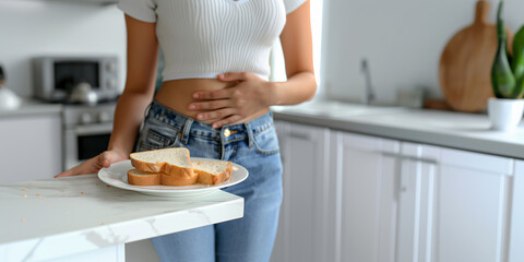 Gluten allergy, young woman with hand on stomach in pain, refusing slice of white bread from plate at meal. concept of gluten-free diet. - obrazy, fototapety, plakaty