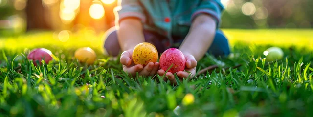 Foto op Plexiglas Kid on Easter egg hunt in spring sunny garden. Child play and searching colorful eggs in fresh green grass. Background for card, banner, flyer with copy space © ratatosk