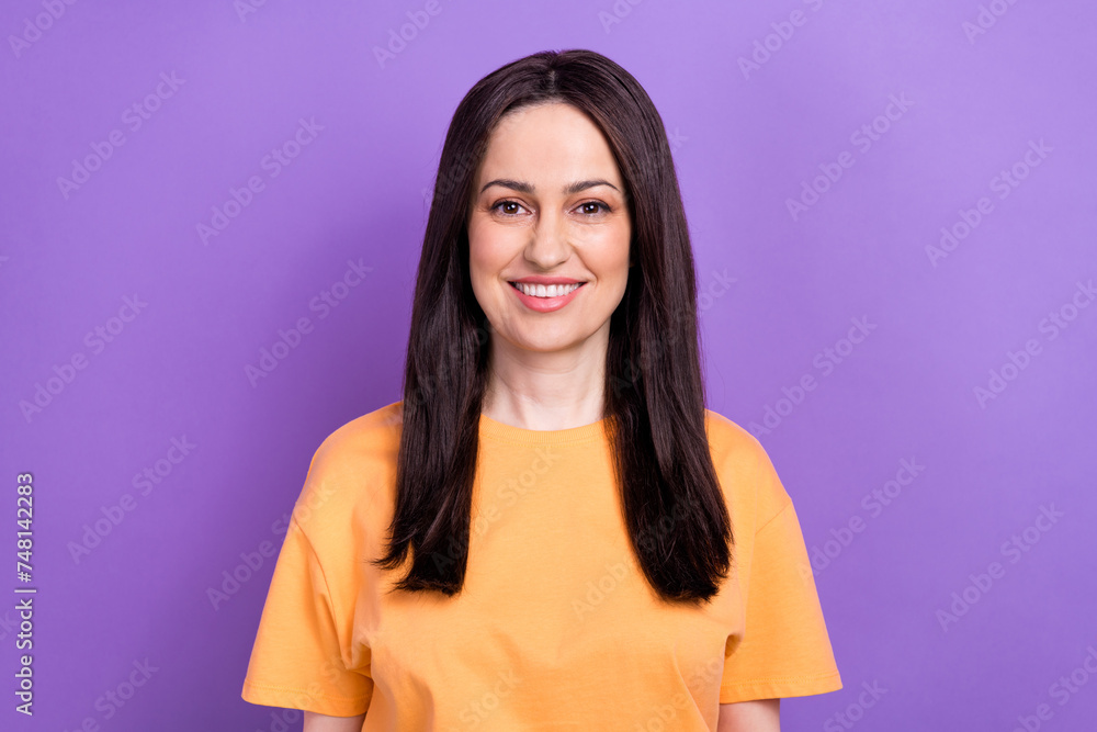 Sticker Portrait of toothy beaming optimistic girl with stylish hairdo wear oversize t-shirt smiling at camera isolated on violet color background