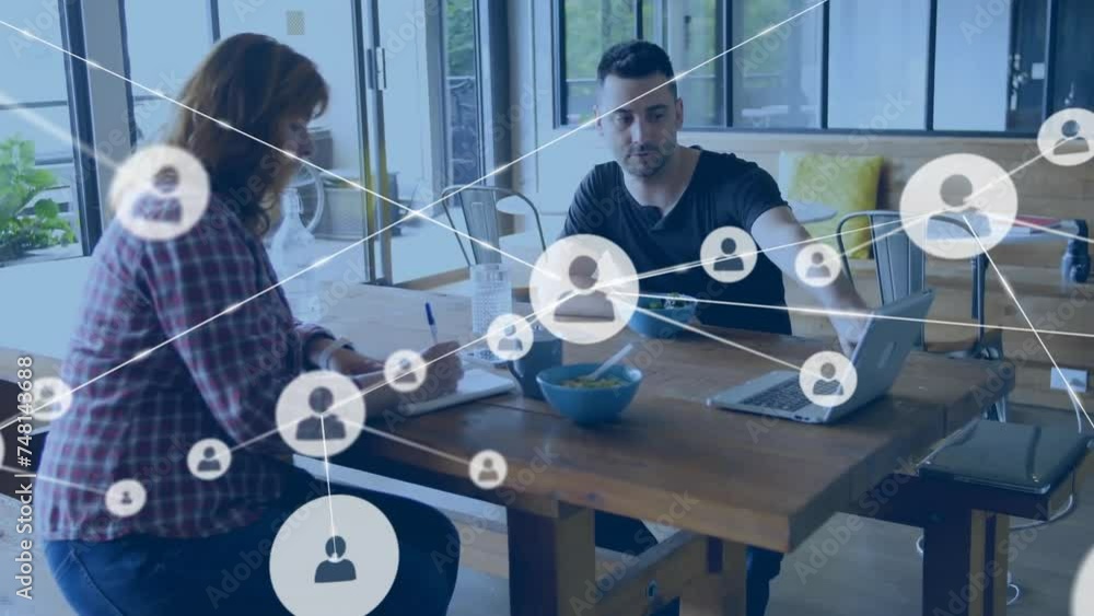 Poster animation of network of connections with icons over caucasian colleagues discussing work