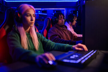 African american man esport gamer playing online video games in a gaming club