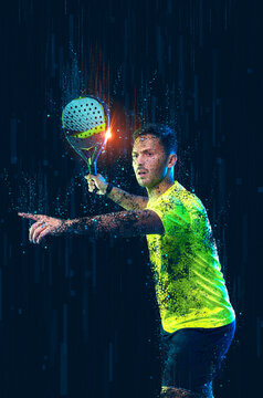 Padel tennis player. Padel open tour. Man athlete with paddle tenis racket and ball on blue background. Sport concept. Download a high quality photo for sports ads at social media stories or shorts.