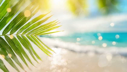 Fotobehang Blur beautiful nature green palm leaf on tropical beach with bokeh sun light wave abstract background. Copy space of summer vacation and business travel concept. © adobedesigner