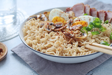 A bowl with ramen, an Asian noodle soup