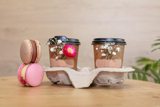takeaway coffee with flowers attached to the cup with adhesive tape, spring coffee