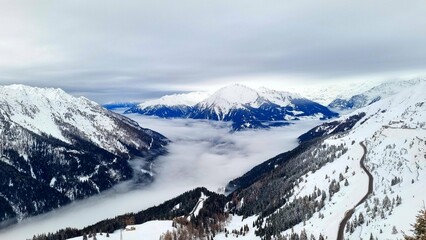 Jaufenpass, South Tyrol - Italy - View of the snow-covered Passeier Valley with a cloud cover