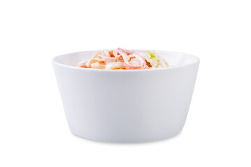 Japanese kani salad with fresh vegetables and crab sticks on a white isolated background