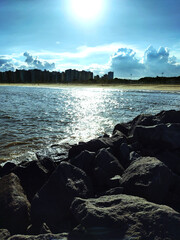 Dusk on Camburi beach, Espírito Santo, Brazil with Vitória city at background. View from the rocks