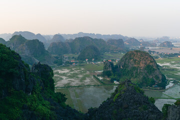 Viewpoint Đầm sen Hang múa is a popular spot for tourists visiting Tam Coc in the Ninh Binh region of Vietnam. In the background are the mountains and rice fields of the region. © Chris