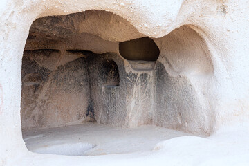 Caves at Uchisar citadel. Medieval living caves inside rock. Cappadocia, Turkey (Turkiye)