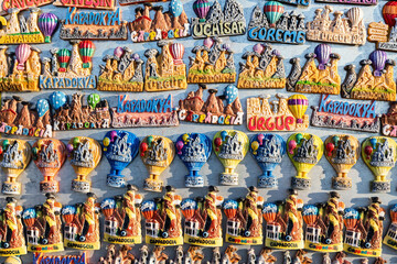 Magnets at souvenir shop display. Memory gift from unique place. Travelling, souvenirs, shopping....