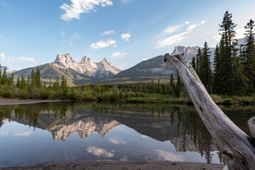 Incredible view of Three Sisters in Canada, Banff National Park with mountains reflecting in calm,...