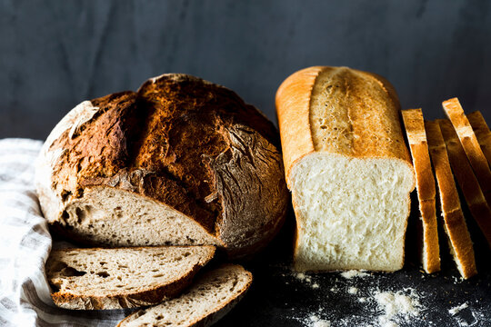 Crusty bread and a white loaf, sliced
