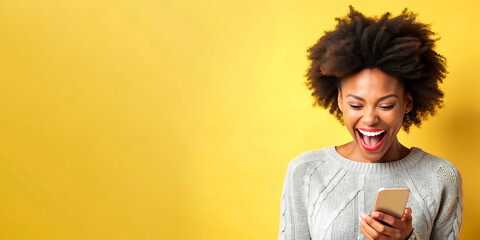 yellow background with afro woman using her mobile