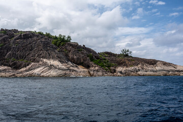 landscape with a beautiful coastline with huge stones on the beaches on a sunny day on one of the...