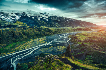 Valahnukur viewpoint of rugged volcanic mountain and glacier river during summer in Icelandic...