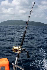 fishing rod for trolling against the backdrop of the sea on a sunny day on one of the Seychelles islands