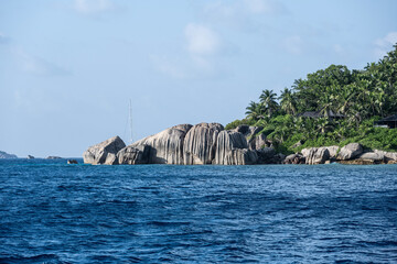 landscape with a beautiful coastline with huge stones on the beaches on a sunny day on one of the...