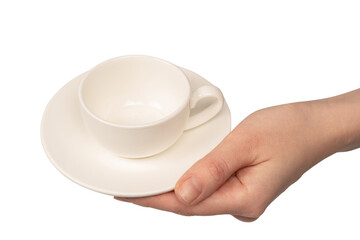 Female hand holding coffee cup and saucer isolated on white background.