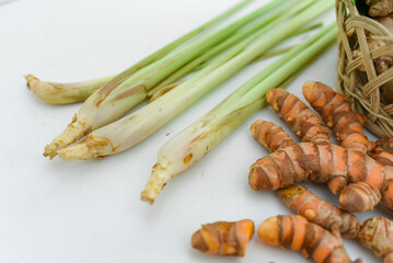 ginger, cinnamon, turmeric, galangal, pandan leaves, lemongrass on a white background