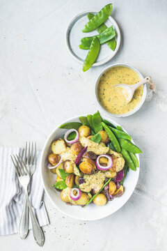 Grilled potato salad with sugar snap peas and garlic mustard dressing
