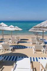 lounge chairs and umbrellas on the beach