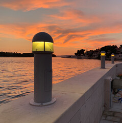 pillar lighting on the pier in the evening - 748171437
