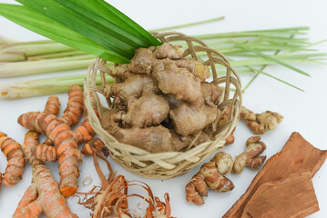 ginger, cinnamon, turmeric, galangal, pandan leaves, lemongrass on a white background