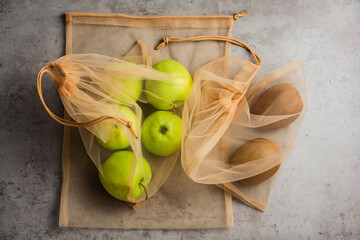 Fruits in reusable bags.