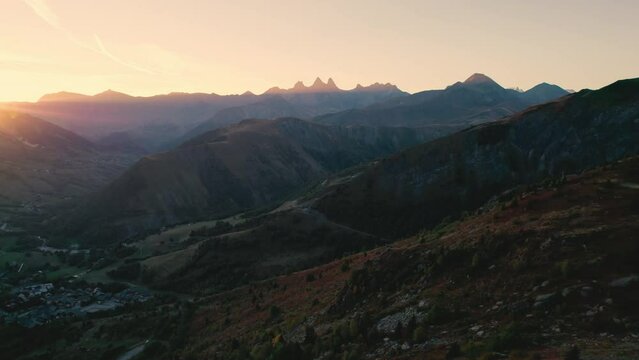 French Alps landscape of sunrise shine over Lac Guichard with rocky mountain and Aiguilles d arves massif in autumn at France
