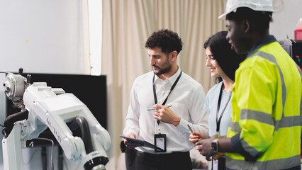 Professional smart robotic engineering team are working and discussing with robotic process or checking, concept of examining manufacturing innovation or invention, technician of futuristic automated.