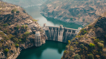Dam marvel stands in a gorge, a testament to human engineering and nature’s might.