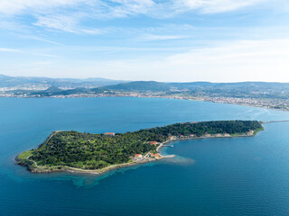 Obraz premium Aerial drone view of Urla district of Izmir, Turkey's third largest city. Iskele - Karantina island - Turkey