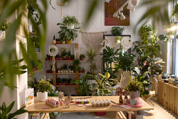 No people shot of eggs and decorations for Easter on wooden table in room with biophilic interior design