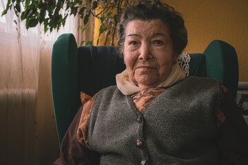 portraits of an old woman in her home