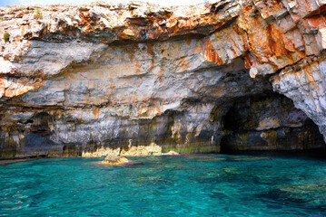 The caves of the ionian Sea side of Santa Maria di Leuca seen from the tourist boat	