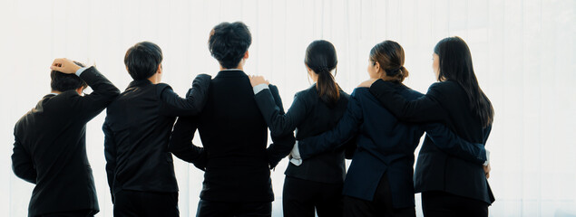 Panoramic banner back view of office worker team standing in line together with friendship posture...