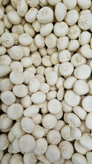 Frozen khinkali in a store, top view. Raw khinkali for sale in a supermarket. Frozen food in the supermarket