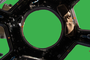 Porthole of space station isolated on green background. Elements of this image furnished by NASA.