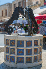 Sea Horse Fountain in Jewish Martyrs Square, old town of Rhodes, Greece - 748197867