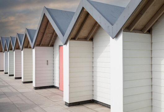 Beach Huts/An image showing a row of trendy beach huts, shot at Weymouth, Dorset, England, UK.