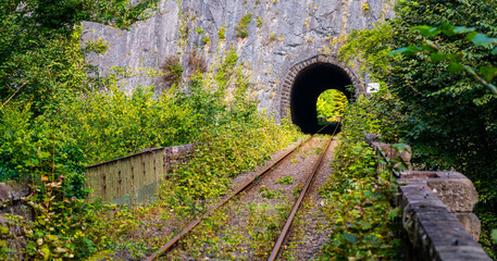 Panoramic view of an old railroad tunnel through limestone rock in the Hönnetal (Sauerland...