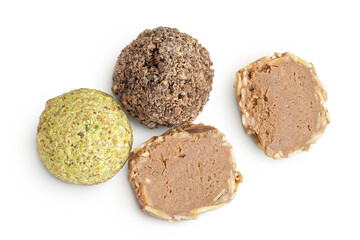 A variety of different truffles Isolated on a white background. Top view. Flat lay.