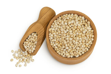 Sorghum seeds in wooden bowl and scoop isolated on white background. Top view. Flat lay.