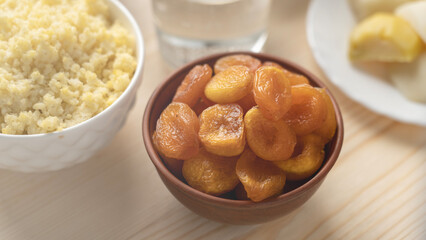 dried apricots in a clay plate, food Great Orthodox Lent.