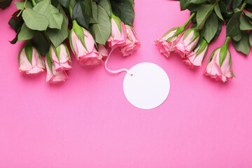Happy Mother's day. Beautiful roses with tag on pink background, flat lay. Space for text