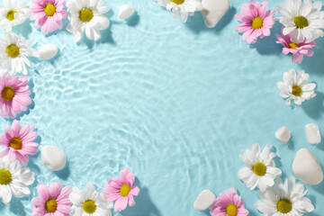 Naklejka na ściany i meble Aqua flora: spring's mirror. Top view shot of white and pink daisies, white pebbles on a turquoise watery background with ample space for expressions