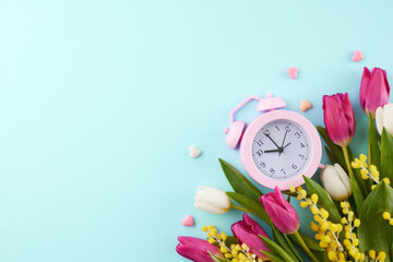 Spring celebration: Get ready for March 8th in honor of women. Overhead shot of an alarm clock,...